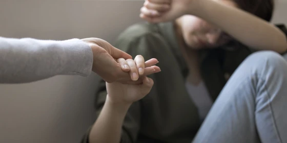 Depressed,Teenager,Kid,Girl,Taking,Hand,Of,Adult,Woman,,Mother,
