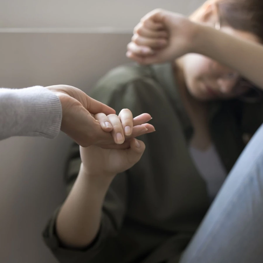 Depressed,Teenager,Kid,Girl,Taking,Hand,Of,Adult,Woman,,Mother,
