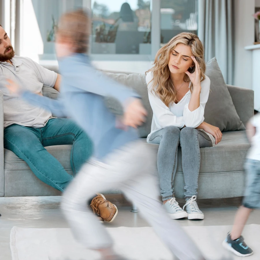 Headache,,Parents,And,Children,By,Sofa,With,Adhd,,Running,And
