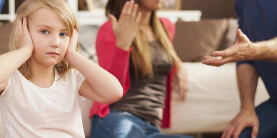 Little girl doesn't want to hear arguing of parents